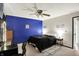 Bedroom with a blue accent wall, carpeted floor, and closet at 200 Forum Dr, Whiteland, IN 46184