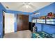 Bright bedroom featuring blue walls, carpet floors, ceiling fan and bunk beds at 200 Forum Dr, Whiteland, IN 46184