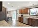 Bright kitchen with stainless steel appliances, light countertops, and access to outdoor dining area at 200 Forum Dr, Whiteland, IN 46184