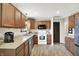 Functional kitchen featuring wooden cabinets, stainless steel appliances, and stylish countertops at 200 Forum Dr, Whiteland, IN 46184