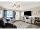 Cozy living room with a large window, stylish furnishings, and a modern entertainment center at 200 Forum Dr, Whiteland, IN 46184