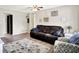 Spacious living room showcasing a plush sofa, neutral decor, and views into the dining area at 200 Forum Dr, Whiteland, IN 46184