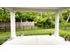 Exterior view from the covered patio to the spacious backyard and mature trees at 200 Mission Terrace Dr, Whiteland, IN 46184