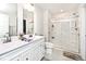 Bright bathroom features double sinks, white cabinetry, and a modern glass shower at 200 Mission Terrace Dr, Whiteland, IN 46184