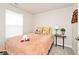 Well-lit bedroom with a cozy bed, cute pillows, and charming side table decor at 200 Mission Terrace Dr, Whiteland, IN 46184