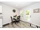 Cozy dining area with modern table and chairs, adjacent to an exit, with natural light at 200 Mission Terrace Dr, Whiteland, IN 46184