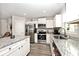 Modern kitchen featuring stainless steel appliances, granite countertops, and ample cabinet space at 200 Mission Terrace Dr, Whiteland, IN 46184
