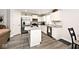 Modern kitchen boasts stainless steel appliances, granite countertops, white cabinets, and an island at 200 Mission Terrace Dr, Whiteland, IN 46184