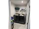 Efficient laundry room with modern washer and dryer units and ample shelving for storage at 200 Mission Terrace Dr, Whiteland, IN 46184