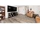 Comfortable living room features a large TV, bookshelf, and cozy leather recliner at 200 Mission Terrace Dr, Whiteland, IN 46184