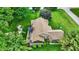 Aerial view of a backyard featuring a deck, patio furniture, play set, and well-maintained lawn at 201 Angela Ct, Noblesville, IN 46062