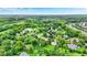 Scenic aerial view of homes nestled among lush trees and a serene pond, creating a peaceful community at 201 Angela Ct, Noblesville, IN 46062
