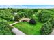 Aerial view of a charming home surrounded by lush greenery and a sprawling, well-manicured lawn at 201 Angela Ct, Noblesville, IN 46062