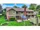 Lush backyard featuring a custom-built play structure, mature trees, and a patio area with outdoor seating at 201 Angela Ct, Noblesville, IN 46062