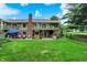 Expansive backyard showcasing a charming patio area, lush green lawn, and well-maintained landscaping at 201 Angela Ct, Noblesville, IN 46062