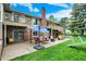Brick home exterior with outdoor patio, fire pit, and lush lawn at 201 Angela Ct, Noblesville, IN 46062
