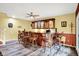 Finished basement featuring a bar with wooden cabinets, countertop, and seating for a cozy gathering space at 201 Angela Ct, Noblesville, IN 46062