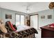 Bright bedroom with carpeted floor, closet, ceiling fan and natural light at 201 Angela Ct, Noblesville, IN 46062