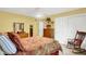 Carpeted bedroom features closet, decorative shelves and rocking chair at 201 Angela Ct, Noblesville, IN 46062