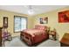 Traditional bedroom boasts a plush carpet and a queen-sized bed at 201 Angela Ct, Noblesville, IN 46062