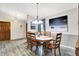 Elegant dining room featuring a wood table, chandelier lighting, and stylish decor at 201 Angela Ct, Noblesville, IN 46062