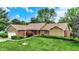 Charming brick and siding home on a manicured lawn, featuring mature trees and a tranquil setting at 201 Angela Ct, Noblesville, IN 46062