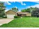 Charming home with an attached garage, lush lawn, mature landscaping, and a brick and siding exterior at 201 Angela Ct, Noblesville, IN 46062