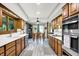 Open kitchen with modern appliances, sleek countertops, and an adjacent dining space at 201 Angela Ct, Noblesville, IN 46062