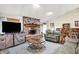 Comfortable living room with a brick fireplace, modern TV, and built-in bookshelves at 201 Angela Ct, Noblesville, IN 46062