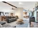 Open-concept living room showcasing a fireplace, comfortable seating, and seamless flow to the dining area at 201 Angela Ct, Noblesville, IN 46062