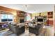 Inviting living room with a brick fireplace, comfortable sofas, and bright natural light at 201 Angela Ct, Noblesville, IN 46062