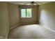 Bedroom showcasing neutral walls, carpet and a window view of the outside at 213 Golf Ct, Greenwood, IN 46143