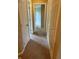 Hallway with linen closet and view into another room at 213 Golf Ct, Greenwood, IN 46143