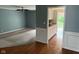 Open-concept space with living room and adjacent kitchen, showcasing the home's layout at 213 Golf Ct, Greenwood, IN 46143