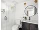 Beautifully renovated bathroom with new vanity, modern fixtures, and glass door shower at 2521 Mcleay Dr, Indianapolis, IN 46220