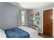 A cozy bedroom with colorful books and shelves at 2521 Mcleay Dr, Indianapolis, IN 46220
