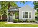 Charming home exterior with a well-manicured lawn, tasteful landscaping, and a welcoming front porch at 2521 Mcleay Dr, Indianapolis, IN 46220