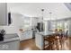 Bright, updated kitchen features white cabinets, a marble countertop, and stainless appliances at 2521 Mcleay Dr, Indianapolis, IN 46220