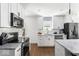 Bright kitchen with stainless appliances and marble countertops at 2521 Mcleay Dr, Indianapolis, IN 46220