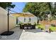 A cozy backyard patio showcases an outdoor dining set shaded by a large sun umbrella at 2521 Mcleay Dr, Indianapolis, IN 46220