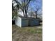 A detached one-car garage with siding needing repair, visible from the property's exterior at 330 N Lasalle St, Indianapolis, IN 46201