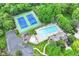 Aerial view of community tennis courts, pool, playground, and a parking lot at 3772 Christina Ct, Carmel, IN 46033