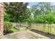Backyard with a wooden fence, mulch, garden bed, and a concrete patio space at 3772 Christina Ct, Carmel, IN 46033