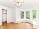 Bedroom featuring a window seat, wood floors, and a walk-in closet at 3772 Christina Ct, Carmel, IN 46033