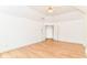 An open bedroom with wood floors, white walls, and a ceiling fan at 3772 Christina Ct, Carmel, IN 46033