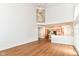 Large living room with wood flooring and an open layout to the kitchen and dining area, perfect for entertaining at 3772 Christina Ct, Carmel, IN 46033