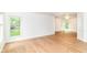 Open living area with hardwood floors, crown molding, and oversized windows for great natural light at 3772 Christina Ct, Carmel, IN 46033