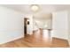 Spacious living room with hardwood floors, crown moulding, and easy access to the kitchen and entryway at 3772 Christina Ct, Carmel, IN 46033