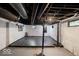 Unfinished basement with painted walls and exposed pipes offering potential for customization and expansion at 3934 N Kenwood Ave, Indianapolis, IN 46208