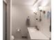 Clean and tidy bathroom with a vanity, mirror, toilet and walk-in shower with bright lighting at 3934 N Kenwood Ave, Indianapolis, IN 46208